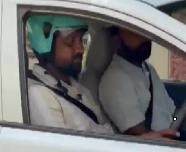 హెల్మెట్‌ ధరించలేదని కారు డ్రైవర్‌కు జరిమానా