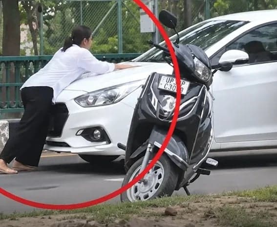 యువతిని కారు బానెట్‌ పై ఈడ్చుకెళ్లిన వ్యక్తి