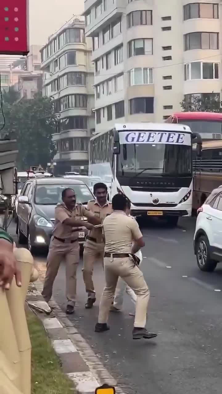 పోలీసుపై కారు డ్రైవర్‌ దాడి