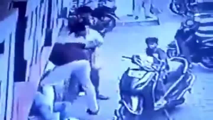 స్కూటీతో ఢీకొట్టి.. వ్యక్తిపై దాడి